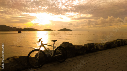 Bicycle at sunrise beach