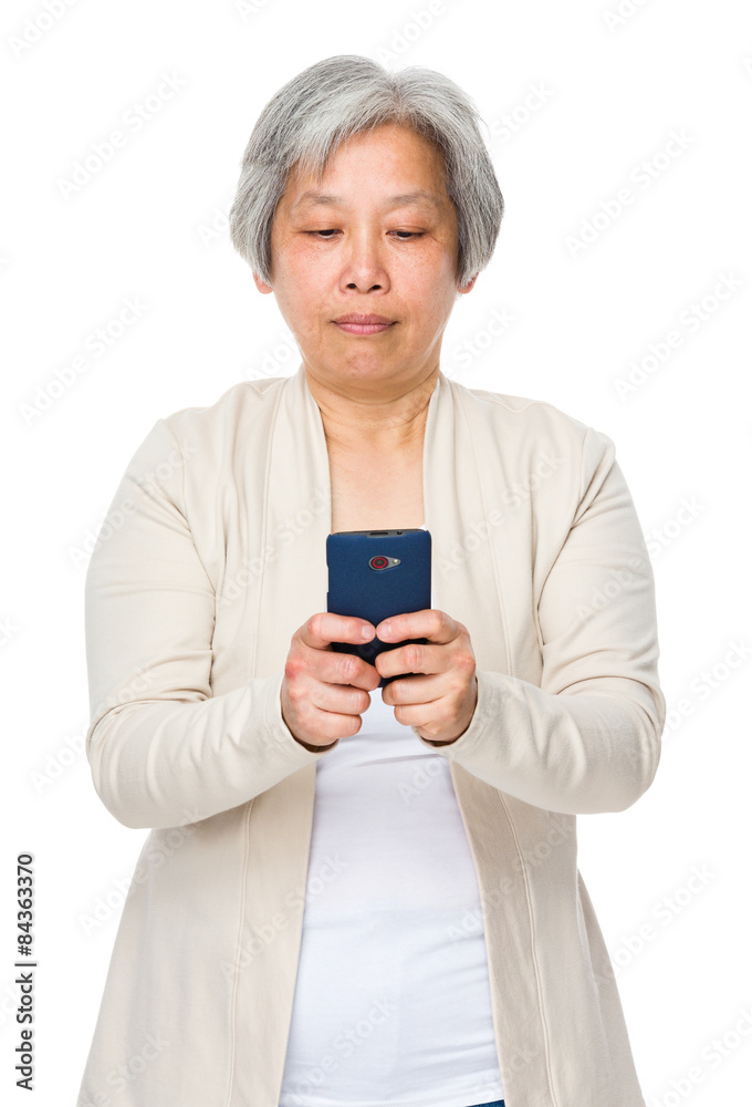 Asian mature woman use of cellphone Asian mature woman use of cellphone