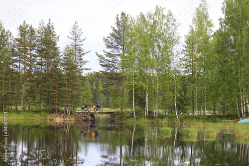 Fototapeta Naklejka Na Ścianę i Meble -  Cyclists journey around Karelia.