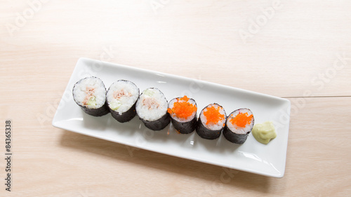 Homemade sushi on wooden table