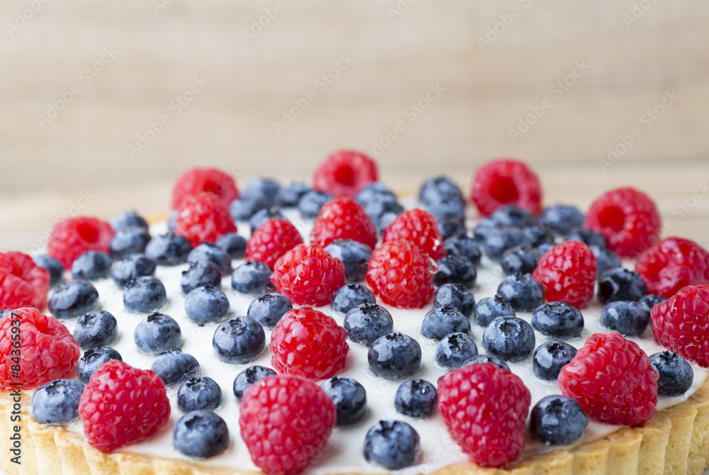 Cake with blueberries and raspberries. Confectionery product. Cake with blueberries and raspberries. Confectionery product.