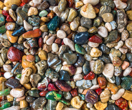 Bild auf Leinwand wet colorful beach pebbles tumbled rocks gemstones, natural background