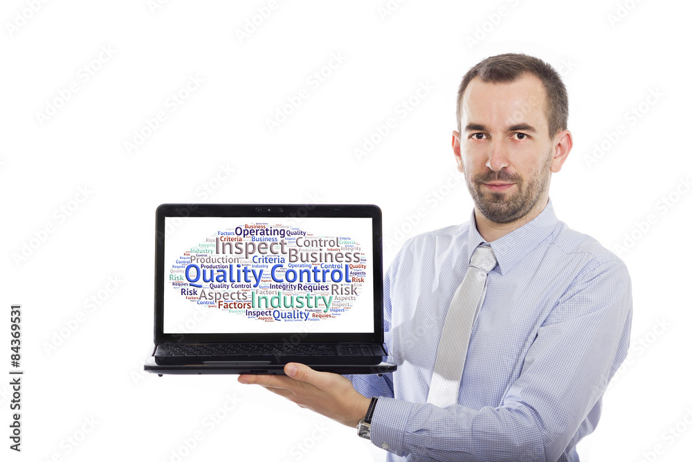 Businessman holding Laptop with Quality Control concept Businessman holding Laptop with Quality Control concept