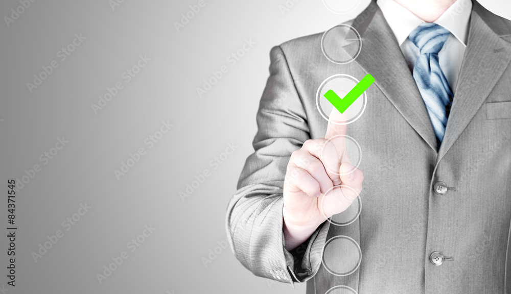business man touching, pressing modern button with green ticking business man touching, pressing modern button with green ticking