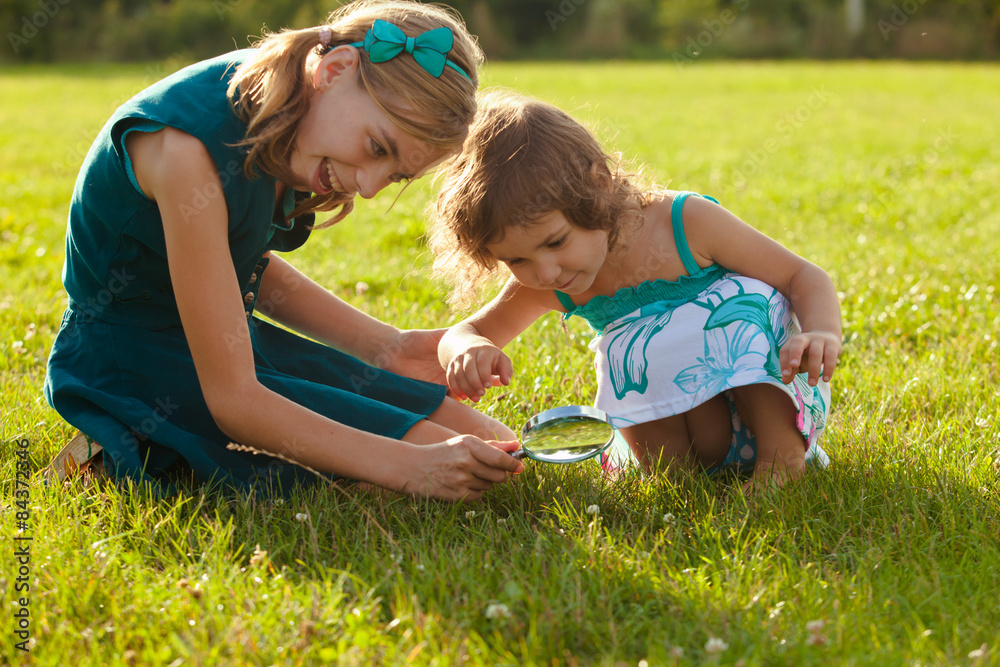 Kid with magnifying glass 