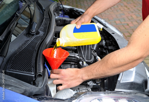 Filling up a car screen wash tank