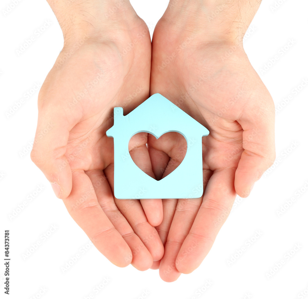 Fototapeta premium Female hands holding house isolated on white