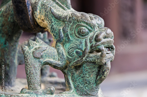 Bronze ancient dragon head in buddha temple photo