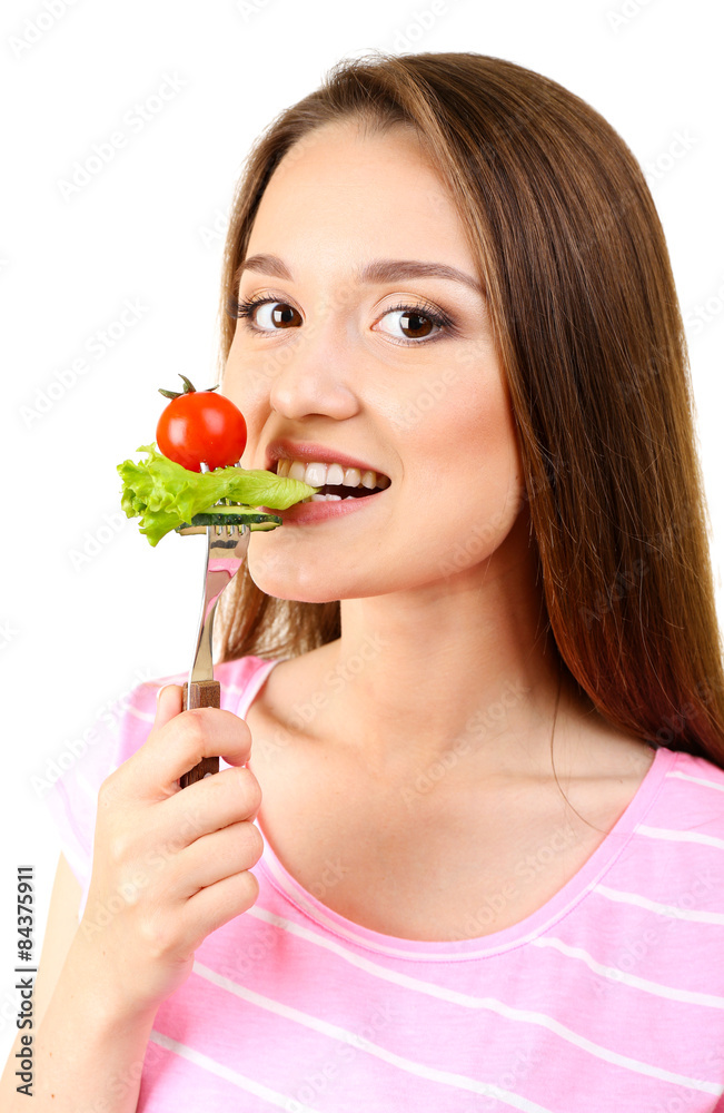 Healthy young woman with vegetables on fork isolated on white Healthy young woman with vegetables on fork isolated on white