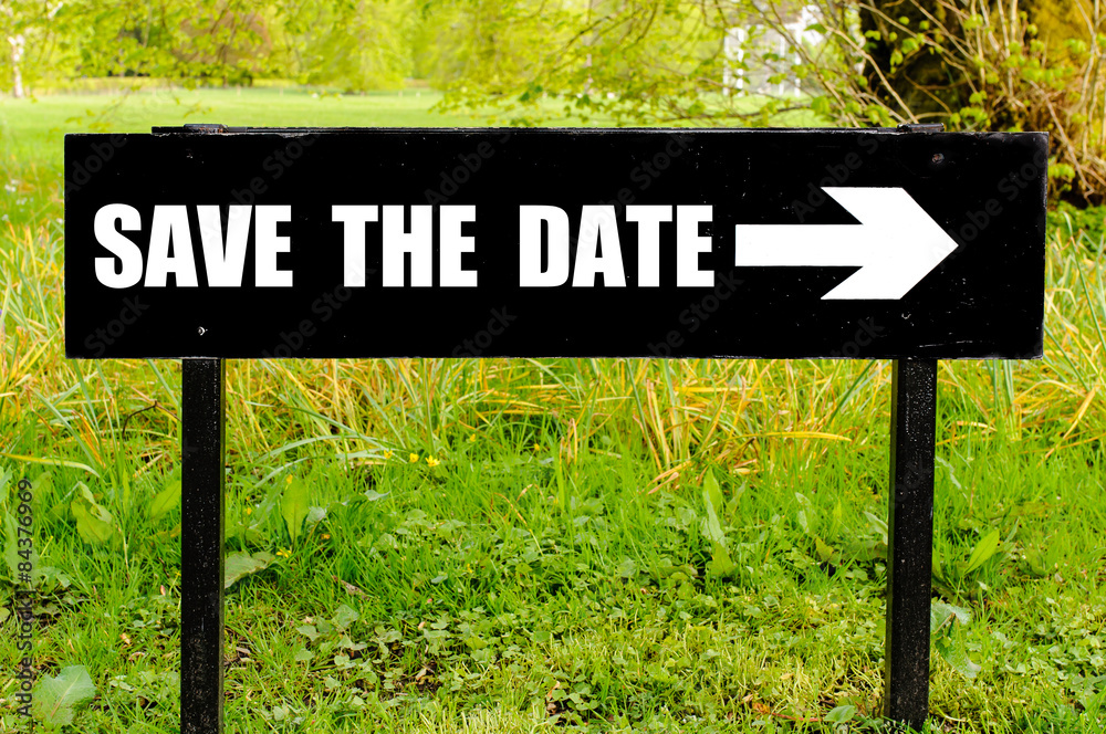 SAVE THE DATE written on directional black metal sign