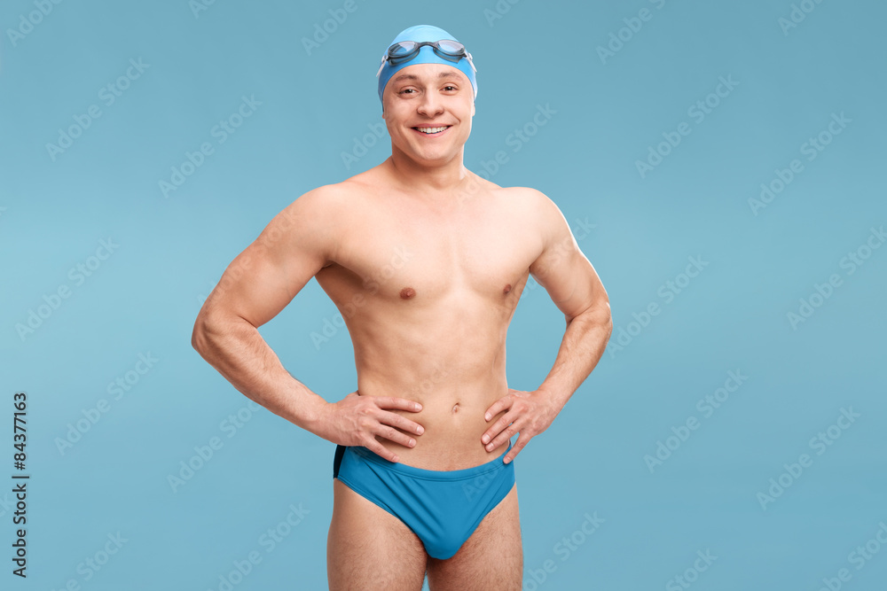 Young male swimmer with swimming goggles