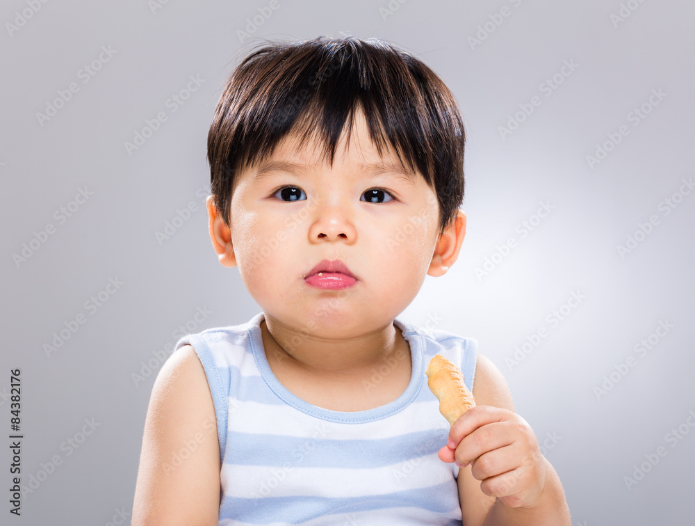 Asian baby boy eat with his biscuit Asian baby boy eat with his biscuit