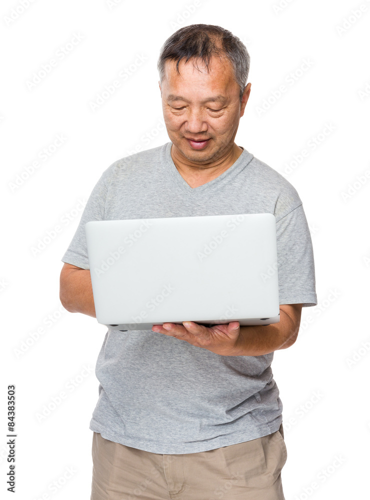 Old man use of laptop computer Old man use of laptop computer