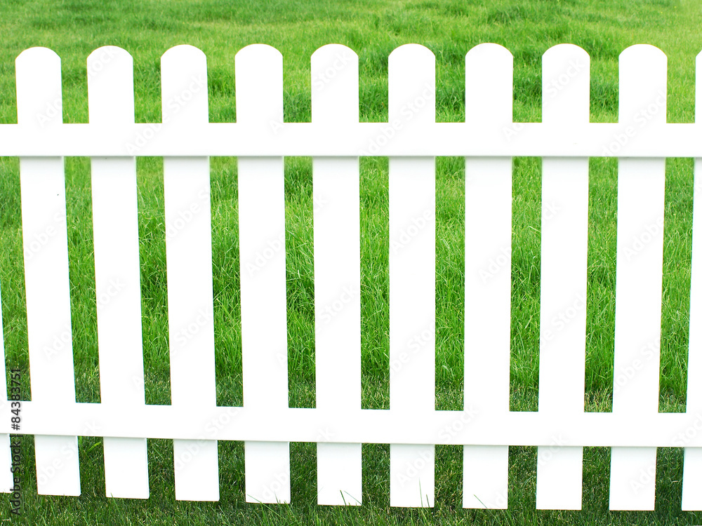 White fence and green grass.