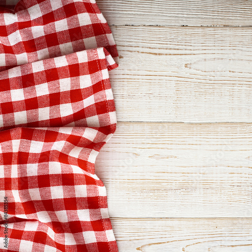 Tablecloth tartan on white wooden table. Flat mock up. Top view.