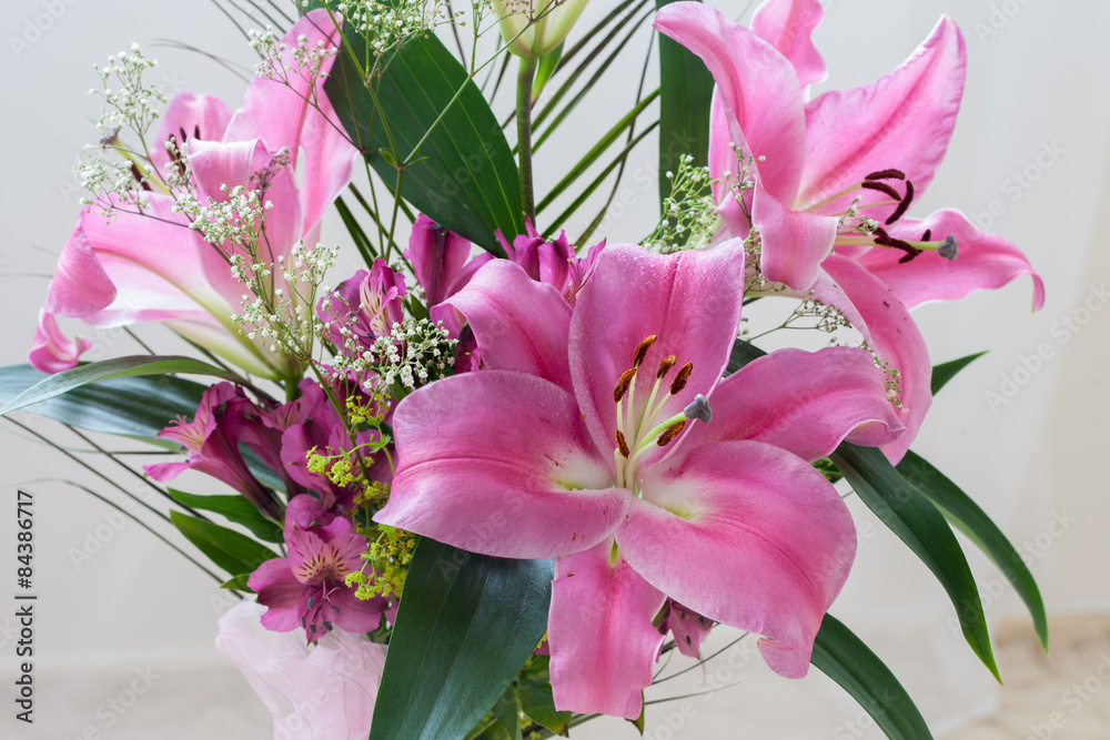 Pink lilies bouquet on a white background Stock Photo | Adobe Stock