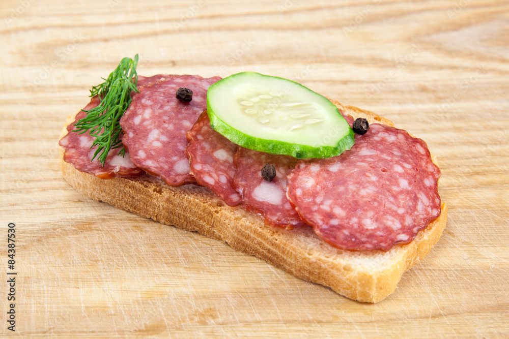 salami sausages on wooden board isolated salami sausages on wooden board isolated