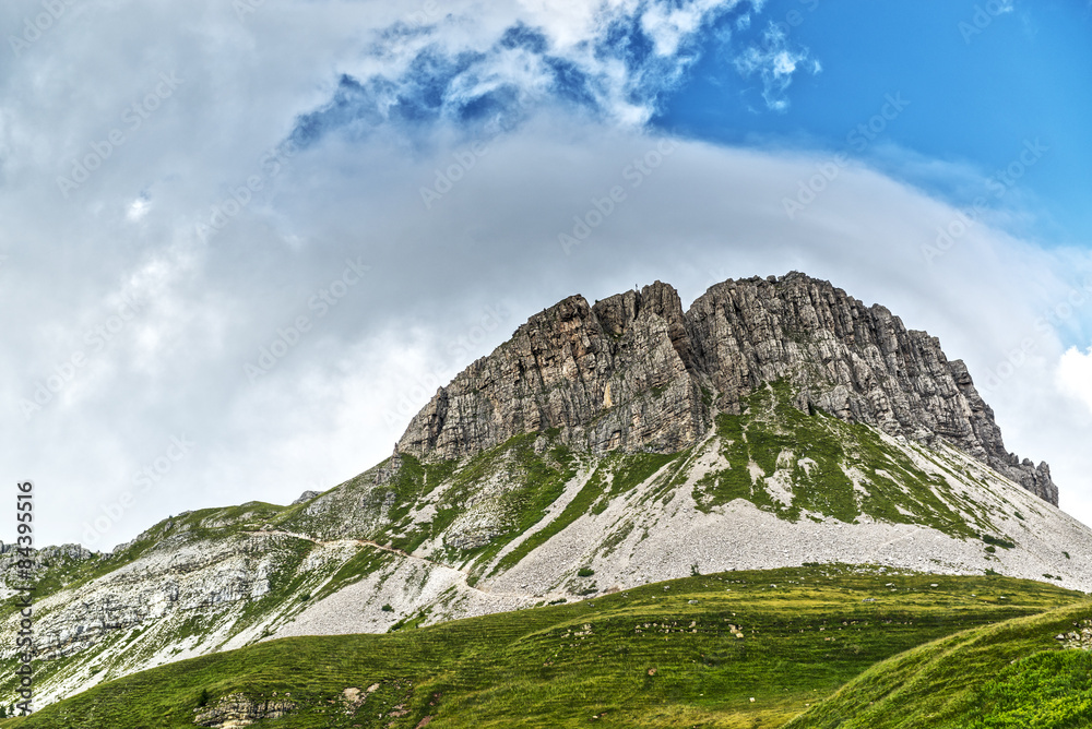 Mount Castellazzo with clouds and sky background near Rolle Pass, Trentino - Italy