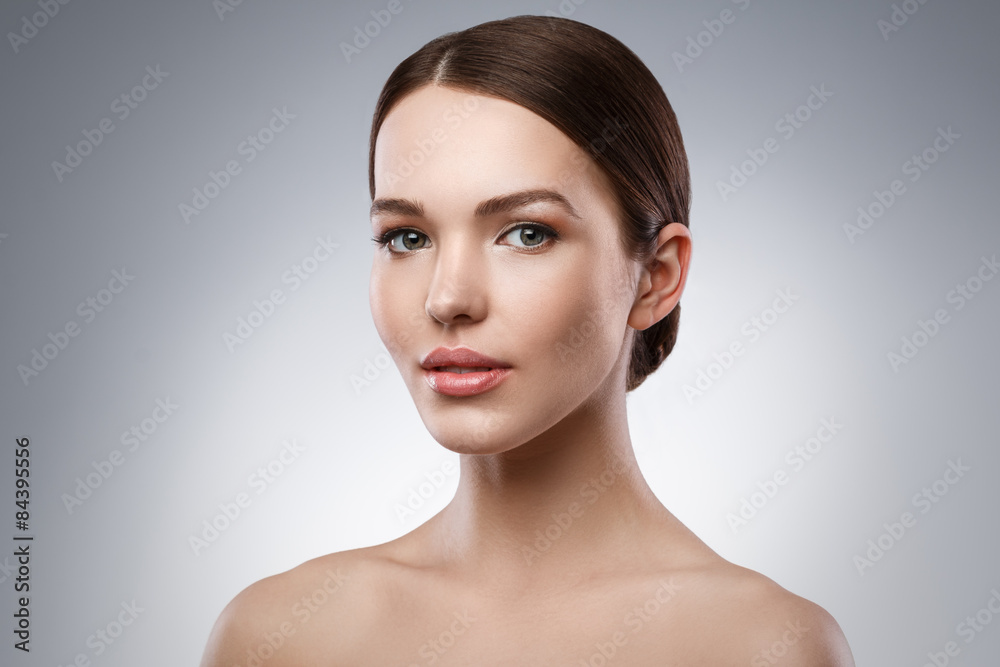 Fototapeta premium Young woman with beautiful face and soft skin