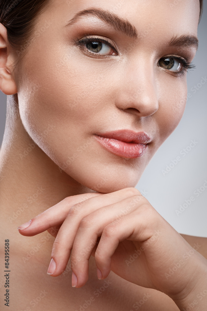 Fototapeta premium Young woman with beautiful face and soft skin