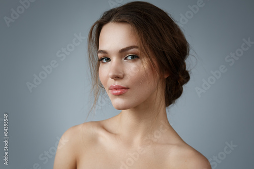 Beautiful woman with natural make up and hairstyle