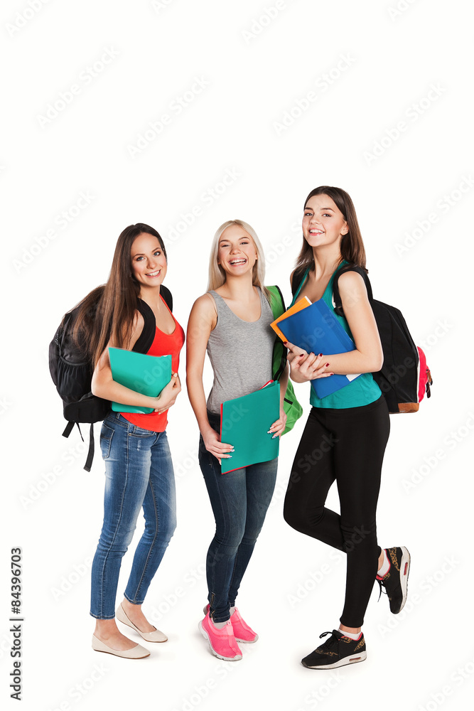 Fototapeta premium Three happy students standing together with fun, while smiling