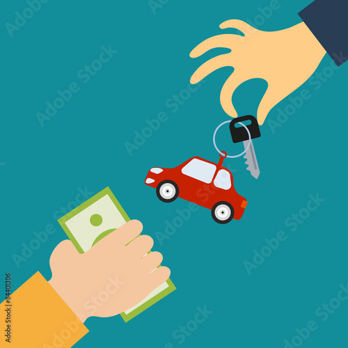 Hand of the seller holds out a key with a tag in the form of car