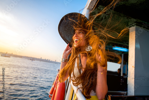 Canvas Print Woman enjoying the sea from ferry boat