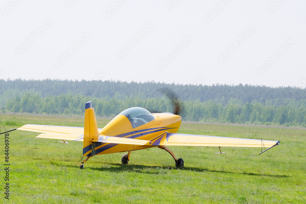 The image of a sport propeller airplane The image of a sport propeller airplane
