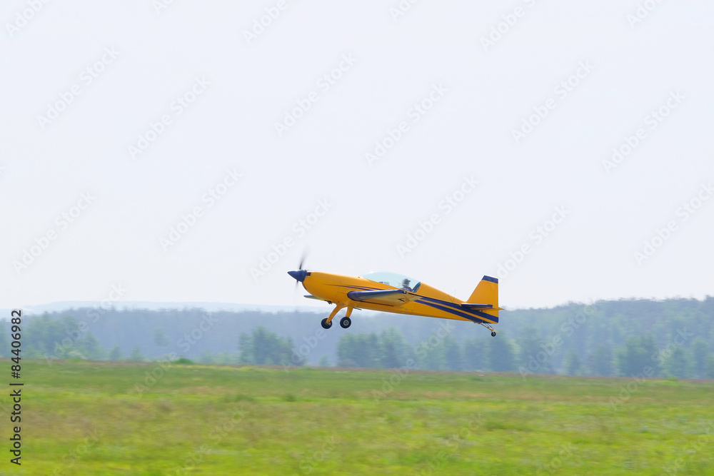 The image of a sport propeller airplane The image of a sport propeller airplane