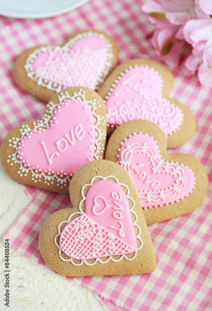 Gingerbread in the shape of heart with pink and white frosting Gingerbread in the shape of heart with pink and white frosting