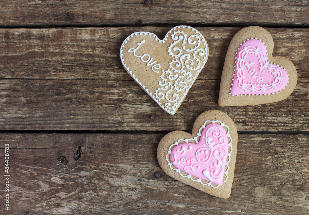 Fototapeta premium Gingerbread in the shape of heart with pink and white frosting