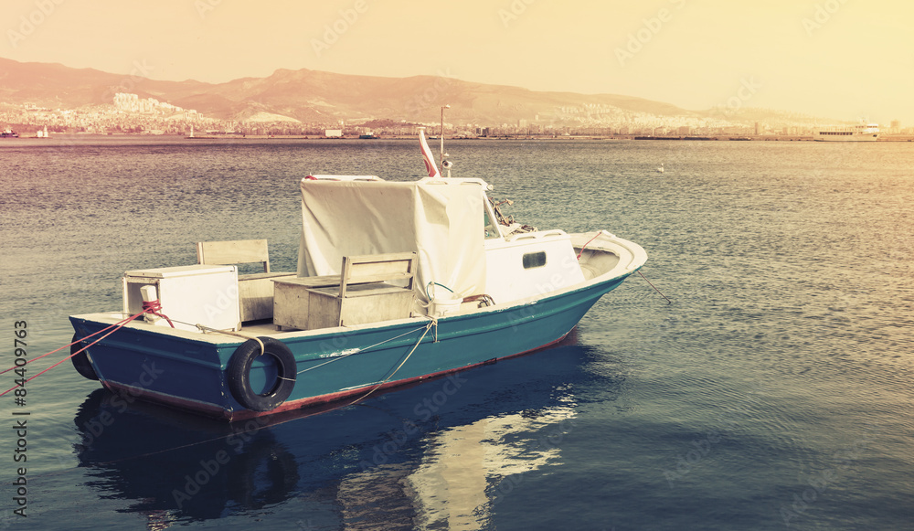Old wooden pleasure boat anchored in Izmir bay Old wooden pleasure boat anchored in Izmir bay