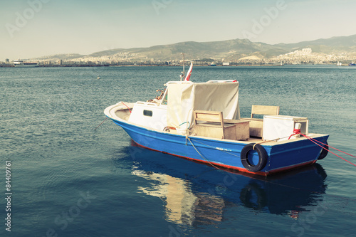 Old wooden pleasure boat anchored in Izmir bay © evannovostro