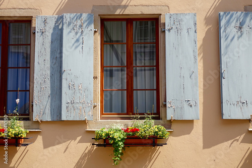 grey window shutter with flowers