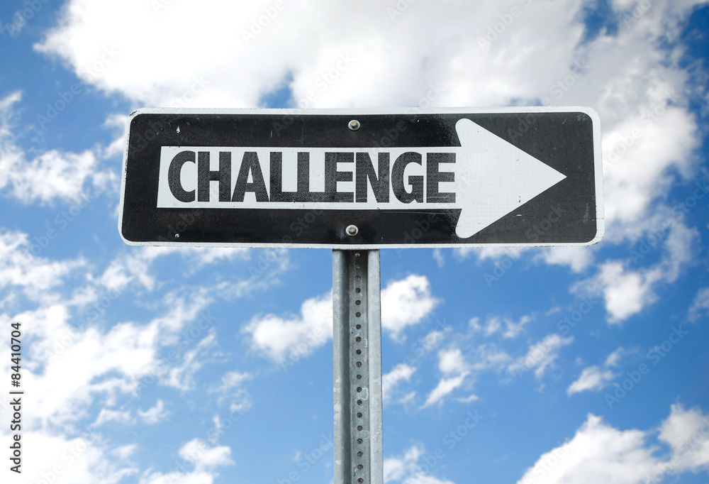 Challenge direction sign with sky background Challenge direction sign with sky background