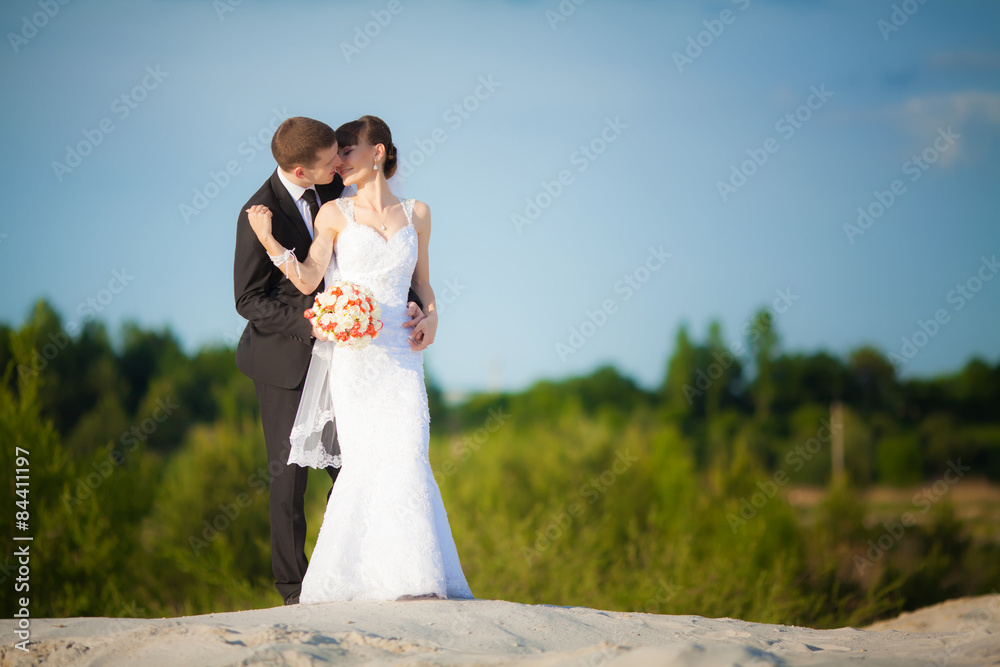 Bride and groom at wedding Day walking Outdoors on spring nature Bride and groom at wedding Day walking Outdoors on spring nature