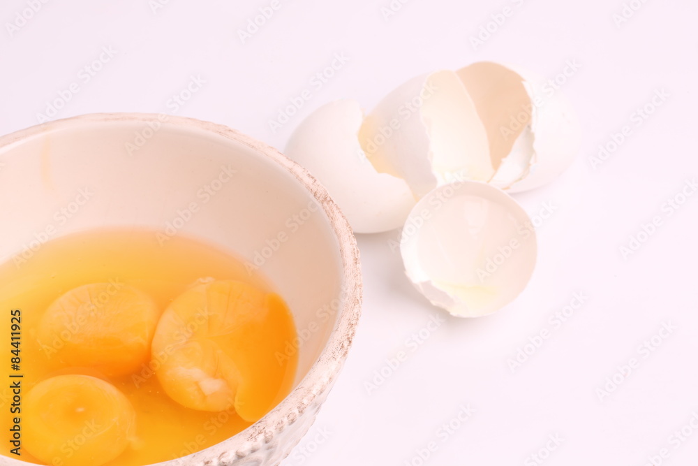 broken egg shells in a bowl on a white background selective soft focus broken egg shells in a bowl on a white background selective soft focus