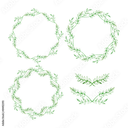 Set of round frames and vignettes made of watercolor branches