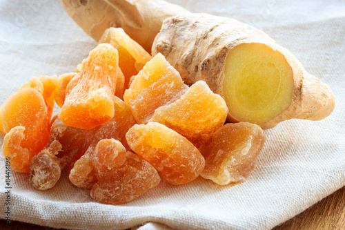 Closeup root and candied ginger on rustic table