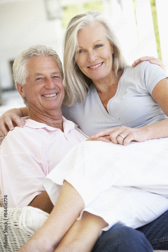 Senior Couple Relaxing In Chair At Home Senior Couple Relaxing In Chair At Home