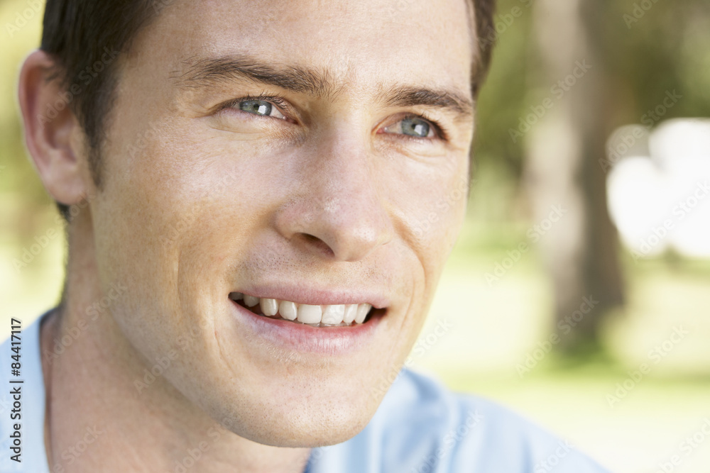 Portrait Of Young Man Relaxing In Park Portrait Of Young Man Relaxing In Park