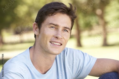 Portrait Of Young Man Relaxing In Park