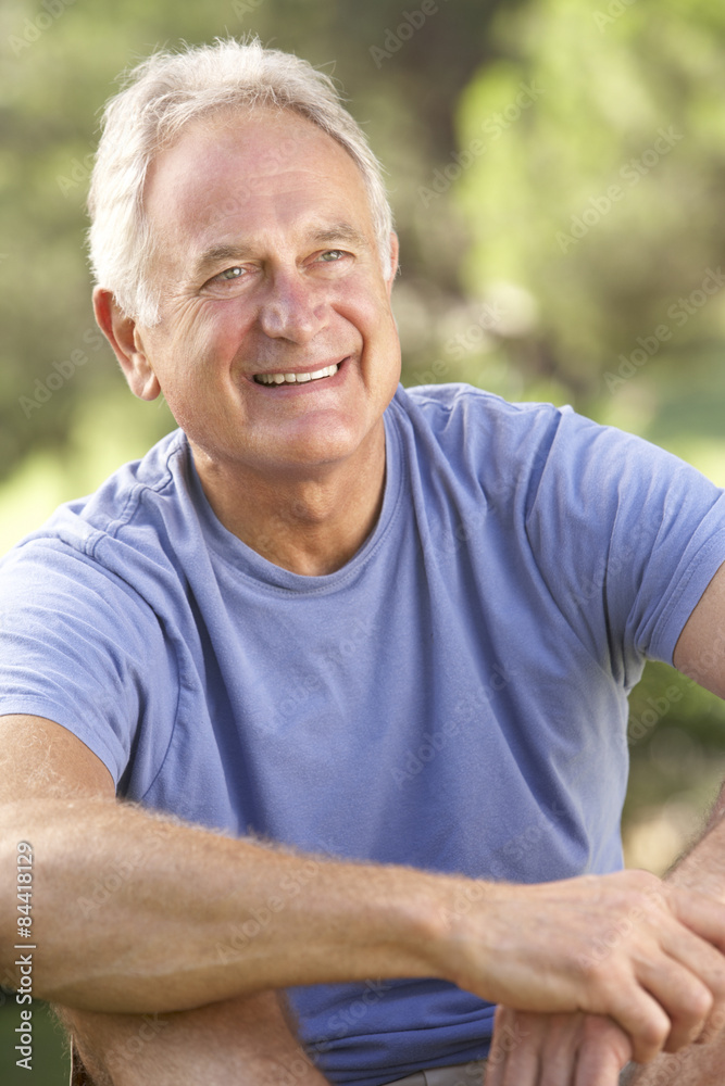 Portrait Of Senior Man Relaxing In Countryside Portrait Of Senior Man Relaxing In Countryside