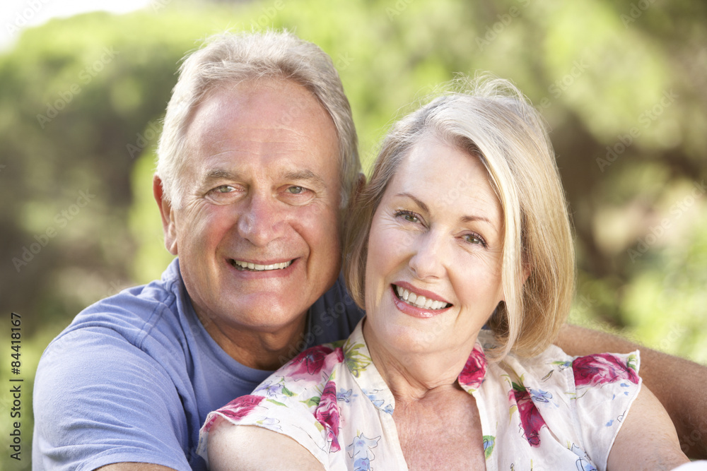 Portrait Of Senior Couple Relaxing In Countryside Portrait Of Senior Couple Relaxing In Countryside