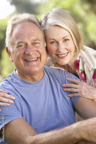 Portrait Of Senior Couple Relaxing In Countryside