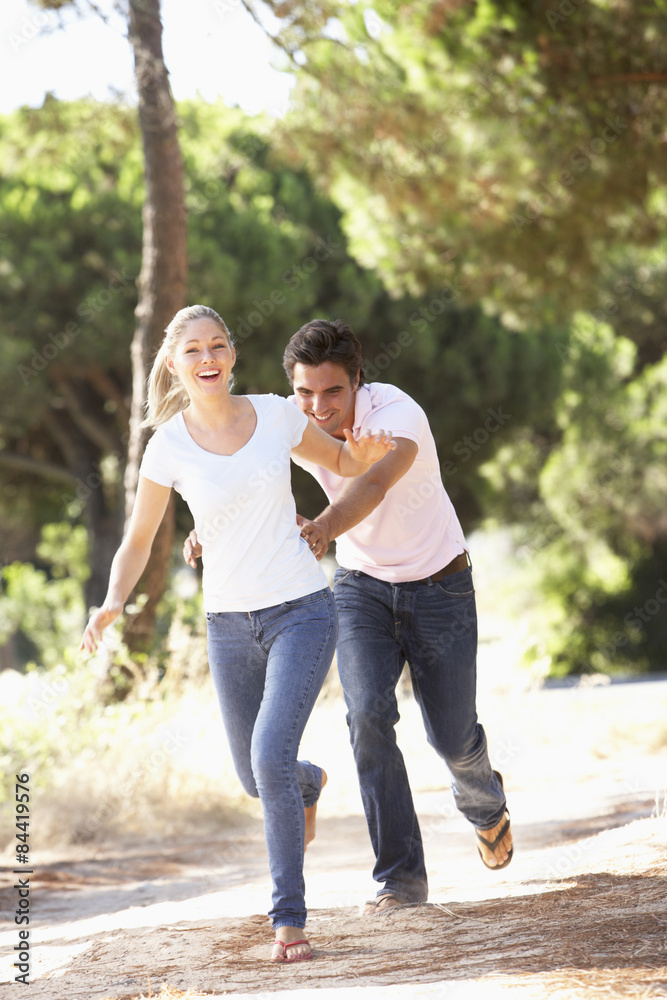 Fototapeta premium Young Couple On Romantic Walk In Countryside