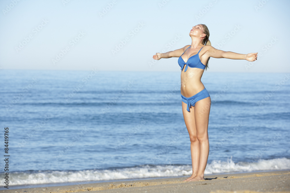 Young Woman Standing On Summer Beach Young Woman Standing On Summer Beach
