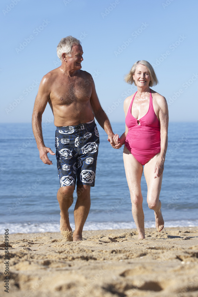 Senior Couple Enjoying Beach Holiday Senior Couple Enjoying Beach Holiday