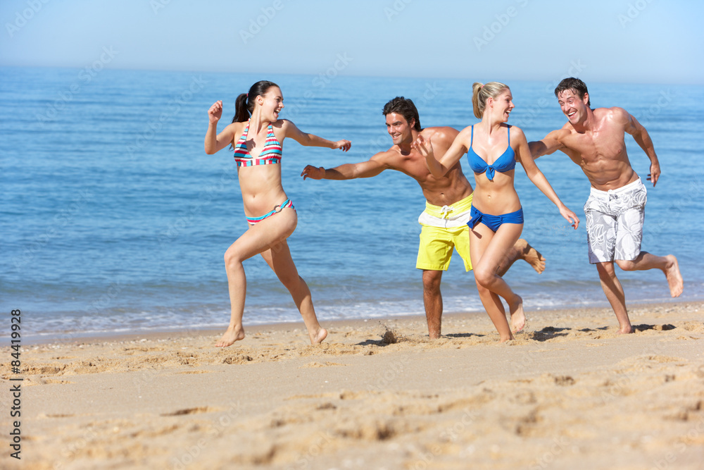 Group Of Friends Enjoying Beach Holiday